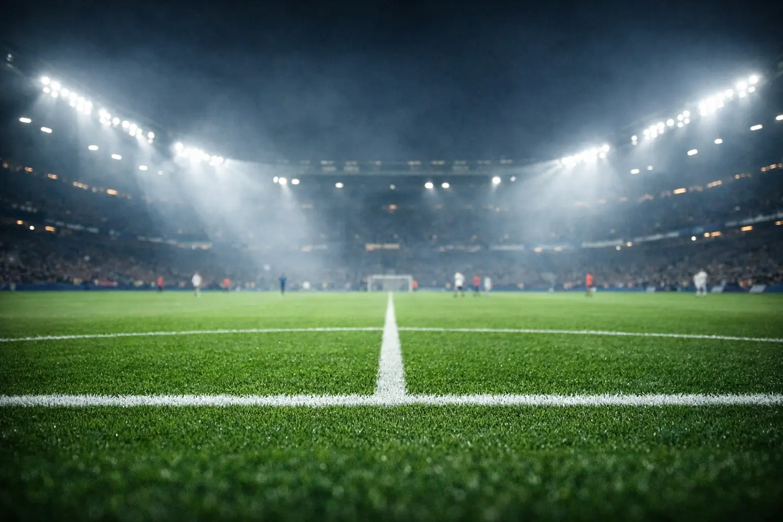 Premier League Fußballspiel in einem vollen englischen Stadion bei Flutlicht